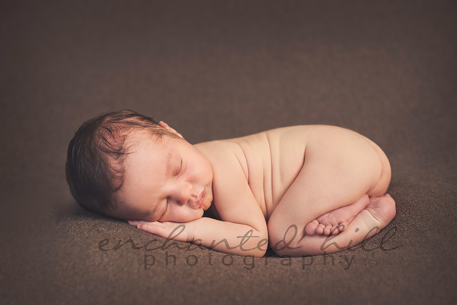 baby sleeping all curled up