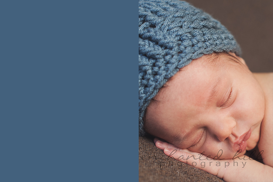 Baby boy in blue hat sleeping