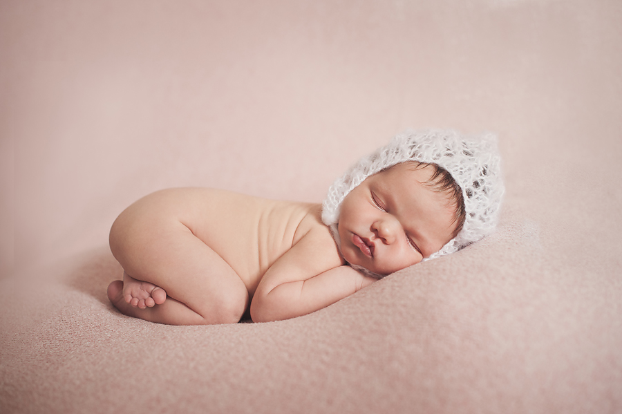 sleeping baby on pink blanket