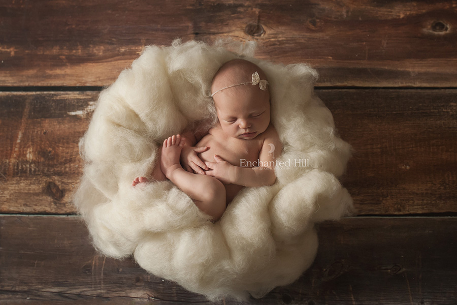 baby posed on natural wool