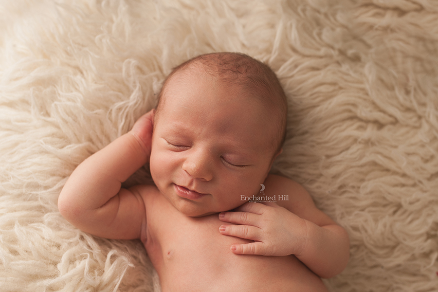 a newborn baby smiling