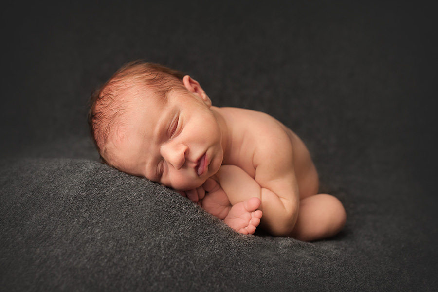 baby pics of a baby posed in taco pose