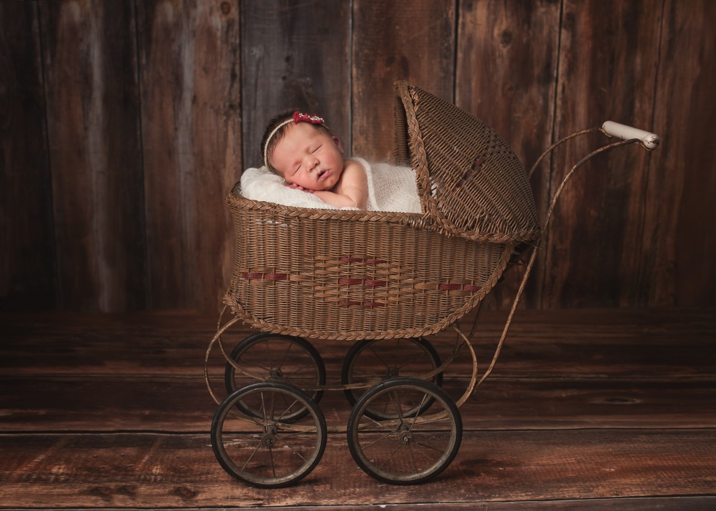 baby in antique carriage