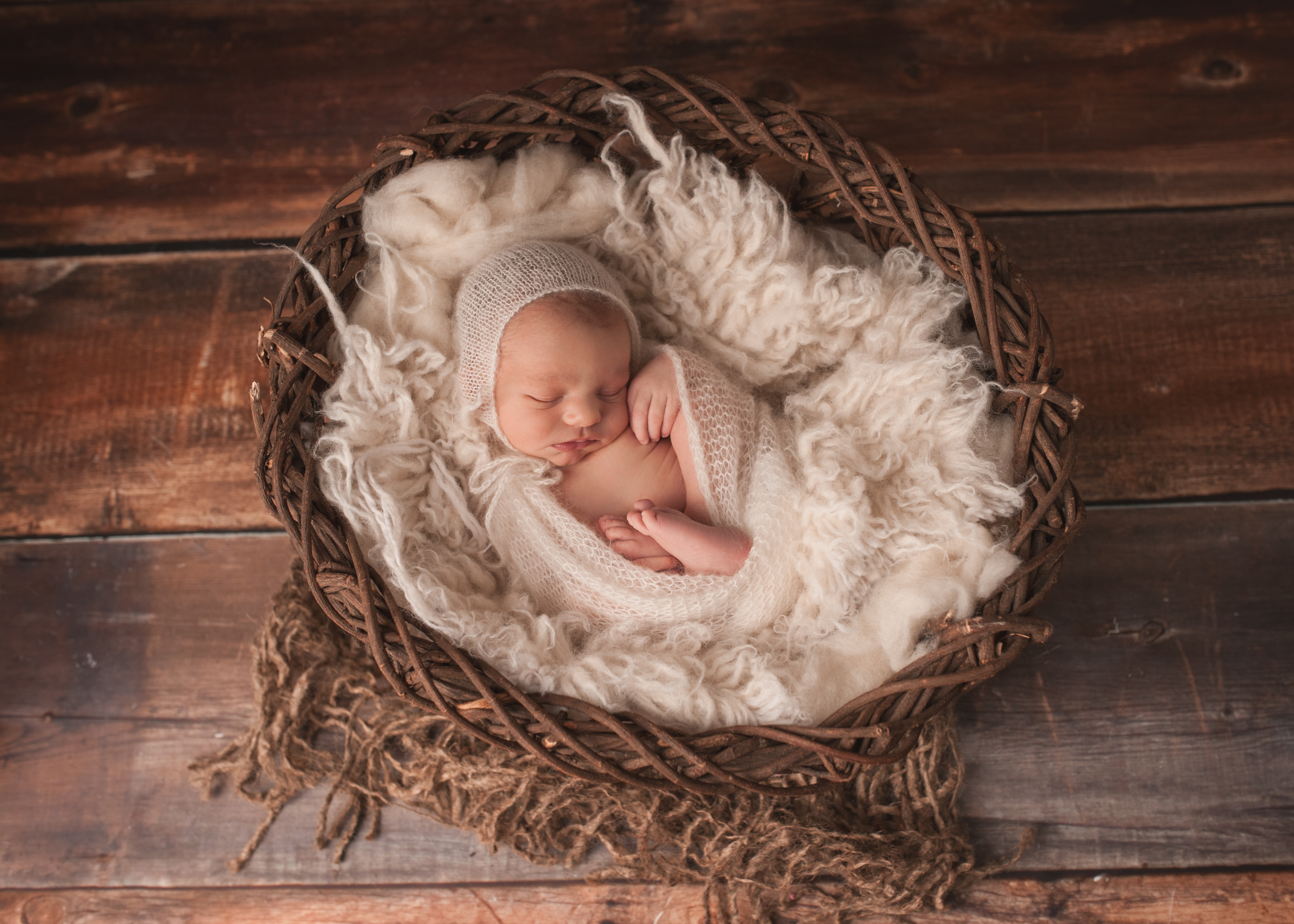 newborn baby boy in cream