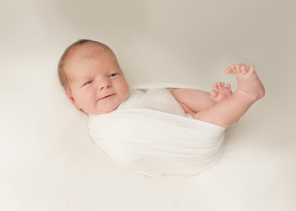 Saint John photography of a new born boy wearing white