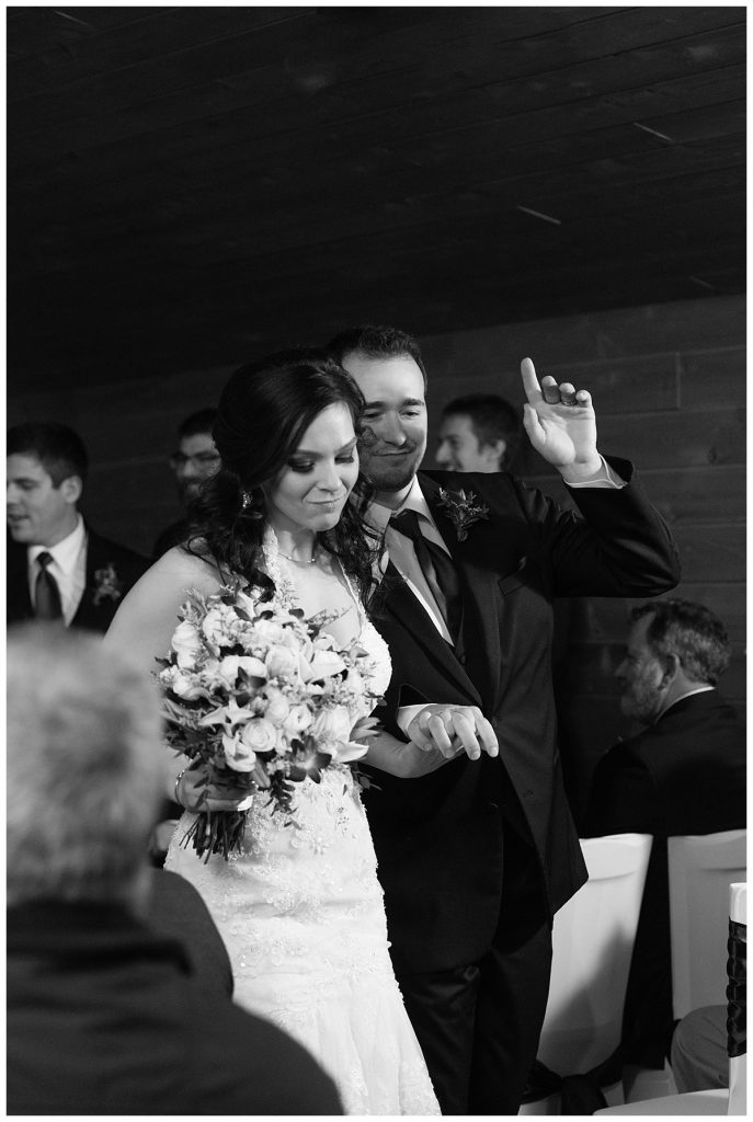 black and white image dancing down their aisle