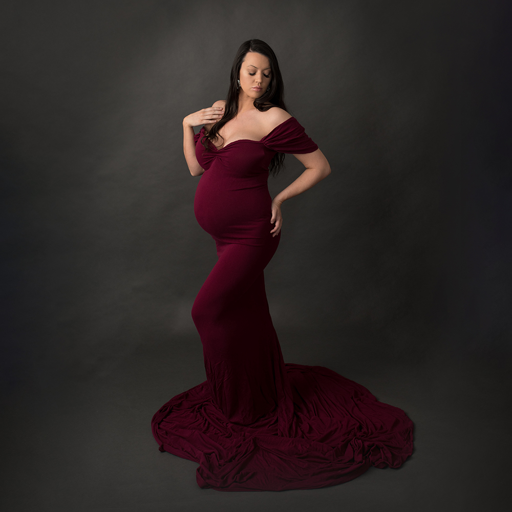 maternity photography in a Saint John Studio, wearing a wine dress