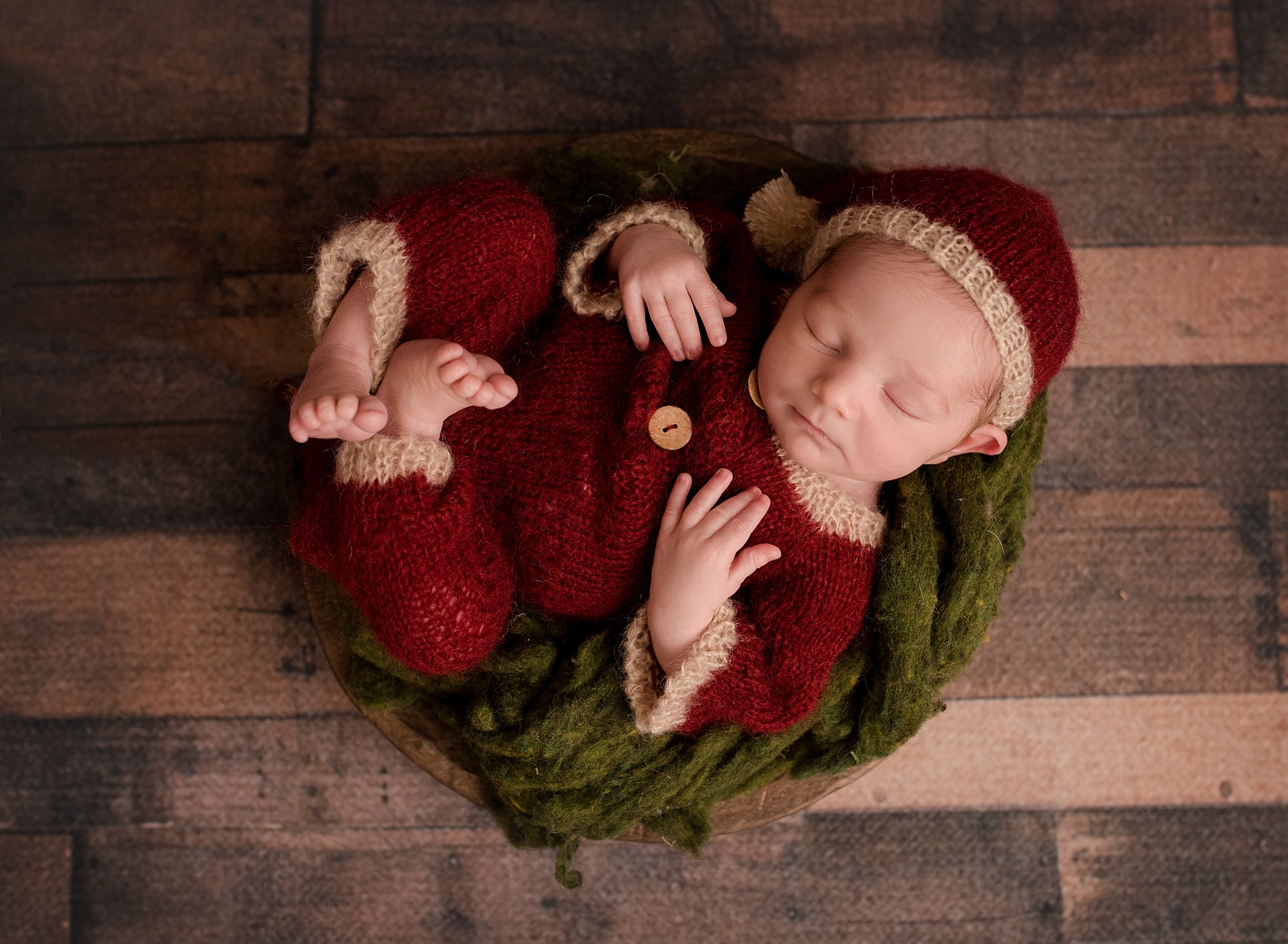 a baby dressed as a christmas elf