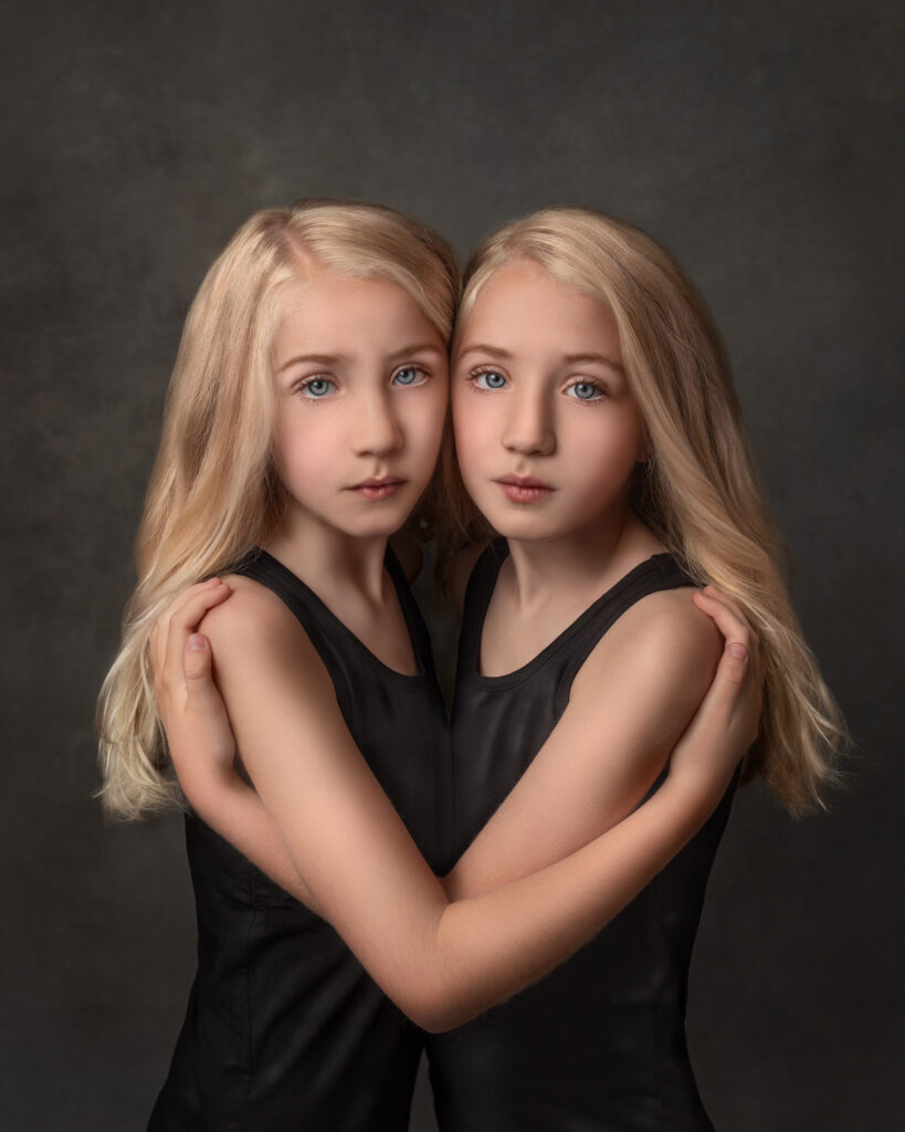 identical twins holdings each other 