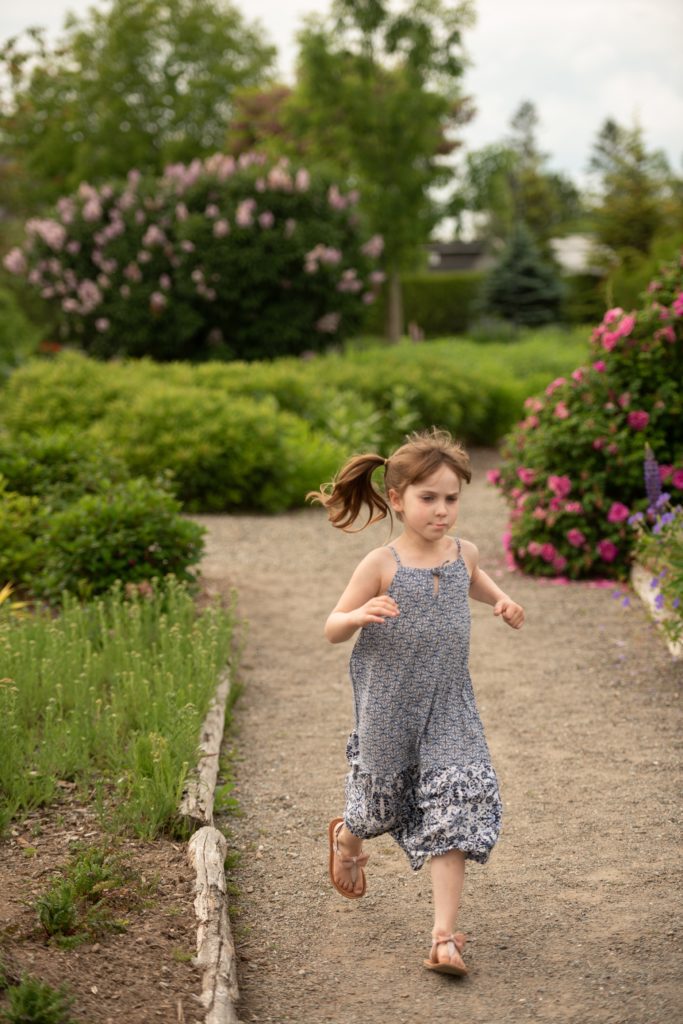 Little girls running down the path at the botanical garden in St Andrews