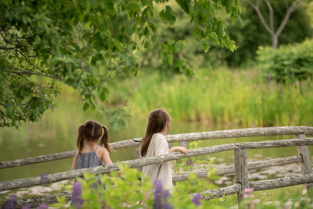two little girls exploring the bridge at Kingsbrae Gardens