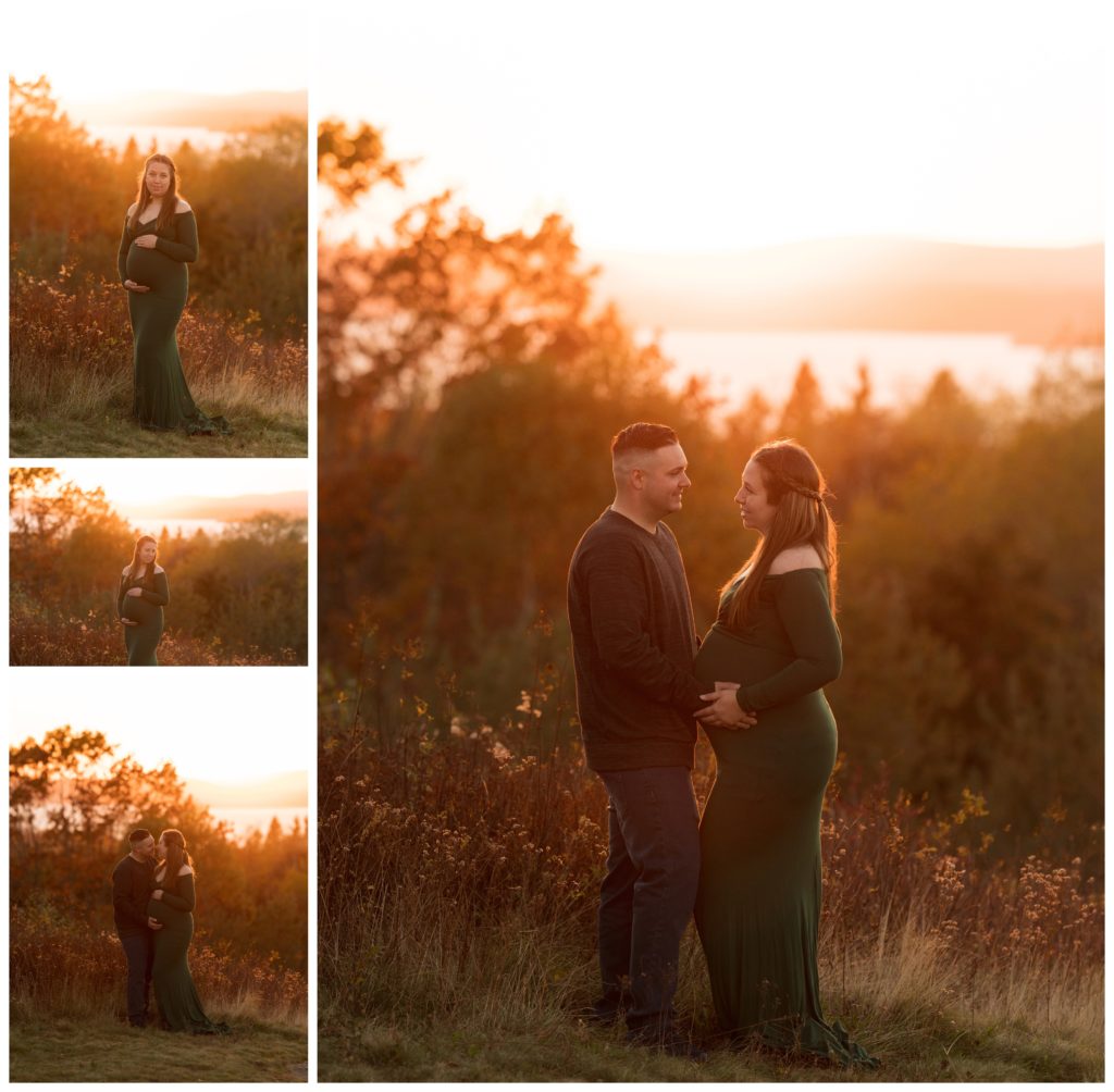 A young couple is standing at sunset on SpyGlass Hill in Rothesay, NB. She is wearing a green dress and posing for her maternity session.
